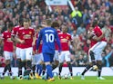 Antonio Valencia celebrates with teammates after opening the scoring during the Premier League game between Manchester United and Everton on September 17, 2017