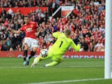 Henrikh Mkhitaryan scores the second during the Premier League game between Manchester United and Everton on September 17, 2017