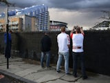 German fans urinate in a street near the Emirates ahead of the Europa League game between Arsenal and FC Koln on September 14, 2017