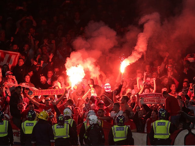 Flares are set off in the away end during the Europa League game between Arsenal and FC Koln on September 14, 2017