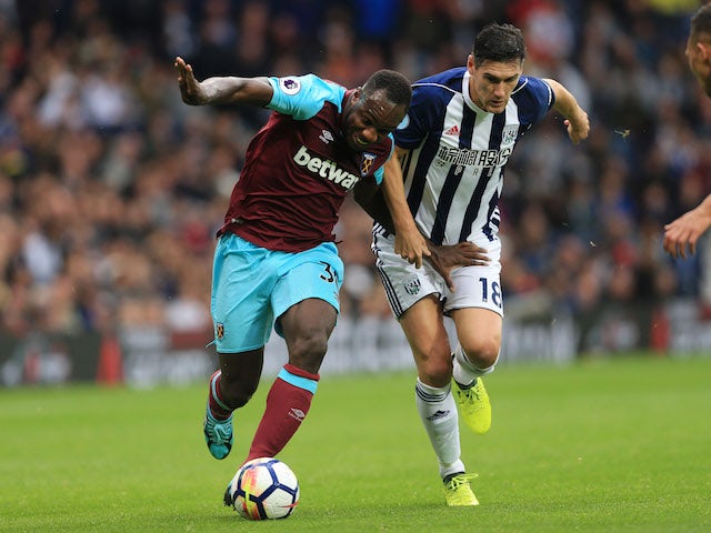 Michail Antonio cops a feel of Gareth Barry during the Premier League game between West Bromwich Albion and West Ham United on September 16, 2017