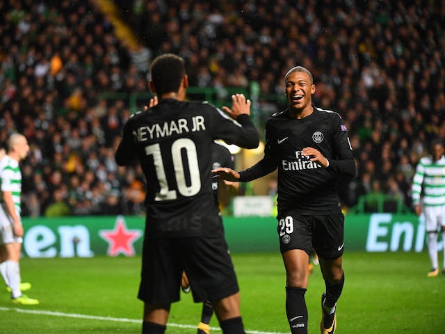 Paris Saint-Germain forwards Neymar and Kylian Mbappe celebrate after scoring during the Champions League win over Celtic on September 12, 2017
