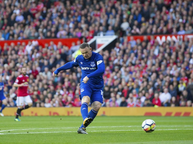 Wayne Rooney takes a shot during the Premier League game between Manchester United and Everton on September 17, 2017