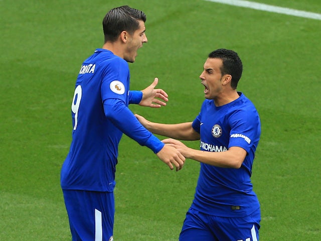 Alvaro Morata celebrates with Pedro after scoring during the Premier League game between Stoke City and Chelsea on September 23, 2017