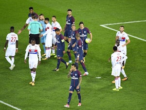 Paris Saint-Germain striker Edinson Cavani takes the ball off Neymar before missing his penalty during his side's 2-0 win over Lyon