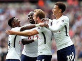 Harry Kane celebrates scoring the second with teammates during the Premier League game between West Ham United and Tottenham Hotspur on September 23, 2017