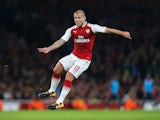 A shaven-headed Jack Wilshere in action during the EFL Cup game between Arsenal and Doncaster Rovers on September 20, 2017