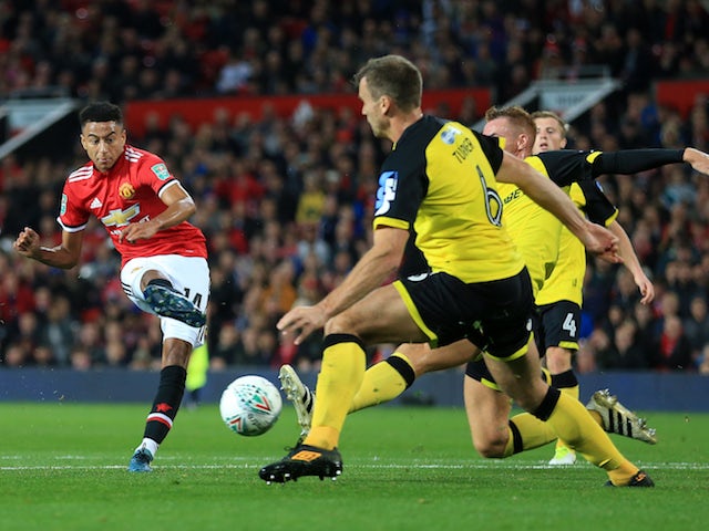 Jesse Lingard scores the third during the EFL Cup game between Manchester United and Burton Albion on September 20, 2017