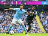Kyle Walker and Jeffrey Schlupp in action during the Premier League game between Manchester City and Crystal Palace on September 23, 2017