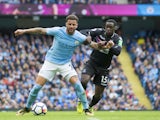 Kyle Walker and Jeffrey Schlupp in action during the Premier League game between Manchester City and Crystal Palace on September 23, 2017