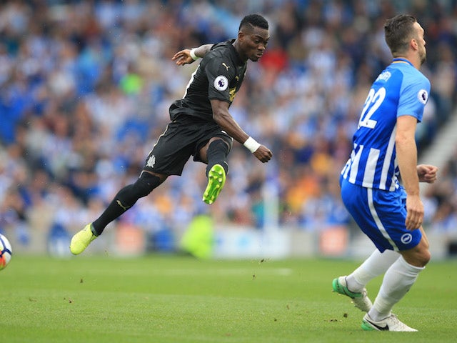 Shane Duffy and Christian Atsu in action during the Premier League game between Brighton & Hove Albion and Newcastle United on September 24, 2017