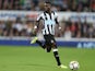 Christian Atsu in action for Newcastle United during their Premier League clash with Liverpool