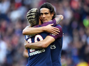 Neymar and Edinson Cavani embrace during the Ligue 1 game between Paris Saint-Germain and Bordeaux on September 30, 2017