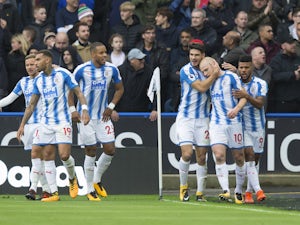 Aaron Mooy celebrates scoring during the Premier League game between Huddersfield Town and Manchester United on October 21, 2017