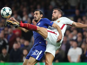 Davide Zappacosta plays air guitar with Kevin Strootman during the Champions League group game between Chelsea and Roma on October 18, 2017