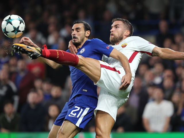 Davide Zappacosta plays air guitar with Kevin Strootman during the Champions League group game between Chelsea and Roma on October 18, 2017