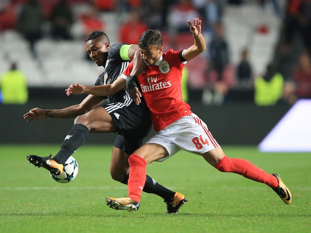 Diogo Goncalves and Antonio Valencia in action during the Champions League group game between Benfica and Manchester United on October 18, 2017
