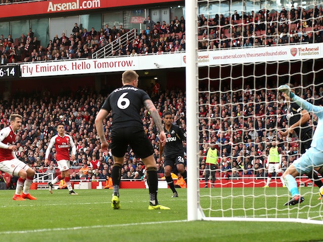 Aaron Ramsey scores during the Premier League game between Arsenal and Swansea City on October 28, 2017