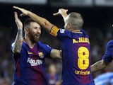 Andres Iniesta celebrates with Lionel Messi after scoring during the La Liga game between Barcelona and Malaga on October 21, 2017