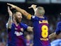 Andres Iniesta celebrates with Lionel Messi after scoring during the La Liga game between Barcelona and Malaga on October 21, 2017