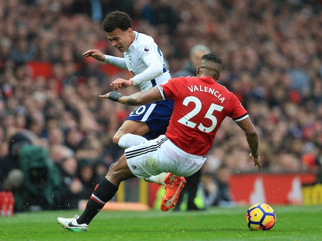 Antonio Valencia and Dele Alli in action during the Premier League game between Manchester United and Tottenham Hotspur on October 28, 2017