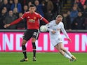 Chris Smalling does battle with Ollie McBurnie during the EFL Cup game between Swansea City and Manchester United on October 24, 2017
