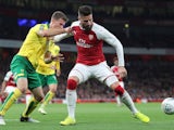 Christoph Zimmerman battles with Olivier Giroud during the EFL Cup game between Arsenal and Norwich City on October 24, 2017