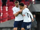 Eric Dier embraces Deli Alli during the Premier League game between Tottenham Hotspur and Liverpool on October 22, 2017