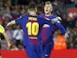 Gerard Deulofeu celebrates with Lionel Messi after scoring during the La Liga game between Barcelona and Malaga on October 21, 2017