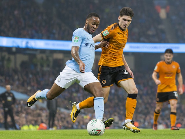 Raheem Sterling and Ruben Vinagre in action during the EFL Cup game between Manchester City and Wolverhampton Wanderers on October 24, 2017