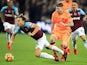 Alberto Moreno tackles Mark Noble during the Premier League game between West Ham United and Liverpool on November 4, 2017