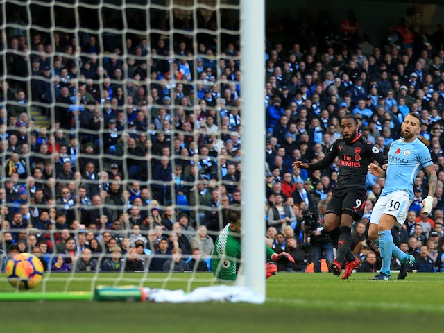Alexandre Lacazette pulls one back during the Premier League game between Manchester City and Arsenal on November 5, 2017