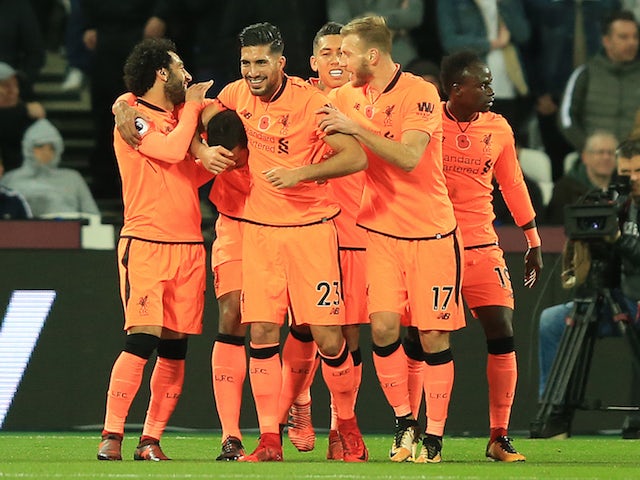 Joel Matip is congratulated by teammates after scoring during the Premier League game between West Ham United and Liverpool on November 4, 2017
