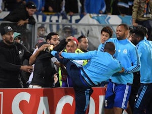 Patrice Evra sent off for 'kicking fan'