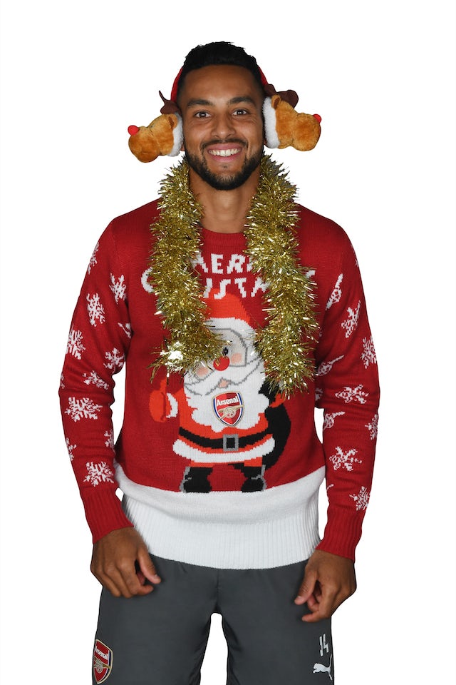 Theo Walcott poses for the Save The Children's Christmas Jumper Day