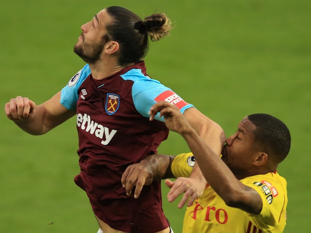 Andy Carroll elbows Marvin Zeegelaar in the face during the Premier League game between Watford and West Ham United on November 19, 2017
