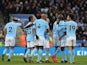 Gabriel Jesus is congratulated by teammates after scoring during the Premier League game between Leicester City and Manchester City on November 18, 2017