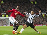 Paul Pogba and Isaac Hayden in action during the Premier League game between Manchester United and Newcastle United on November 18, 2017