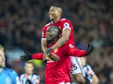 Romelu Lukaku celebrates scoring with Antonio Valencia during the Premier League game between Manchester United and Newcastle United on November 18, 2017