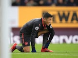 Alexis Sanchez winces during the Premier League game between Burnley and Arsenal on November 26, 2017