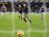Alexis Sanchez scores from the spot during the Premier League game between Burnley and Arsenal on November 26, 2017