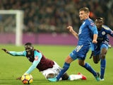 Arthur Masuaku and Marc Albrighton in action during the Premier League game between West Ham United and Leicester City on November 24, 2017