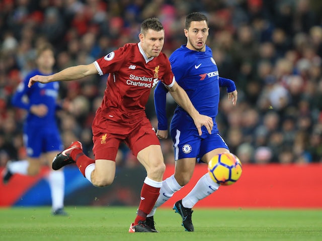 Eden Hazard and James Milner in action during the Premier League game between Liverpool and Chelsea on November 25, 2017