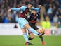 Matthew Lowton and Alexis Sanchez in action during the Premier League game between Burnley and Arsenal on November 26, 2017