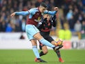 Matthew Lowton and Alexis Sanchez in action during the Premier League game between Burnley and Arsenal on November 26, 2017
