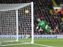 Willian scores past Simon Mignolet during the Premier League game between Liverpool and Chelsea on November 25, 2017