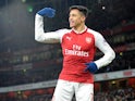 Alexis Sanchez celebrates during the Premier League game between Arsenal and Huddersfield Town on November 29, 2017