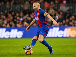 Andres Iniesta coy on China move