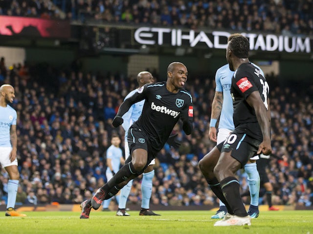 Angelo Ogbonna celebrates opening the scoring during the Premier League game between Manchester City and West Ham United on December 3, 2017