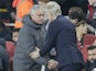 Arsene Wenger and Jose Mourinho share a tentative handshake during the Premier League game between Arsenal and Manchester United on December 2, 2017